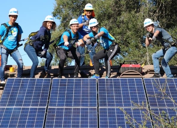 ECE students installing a solar panel